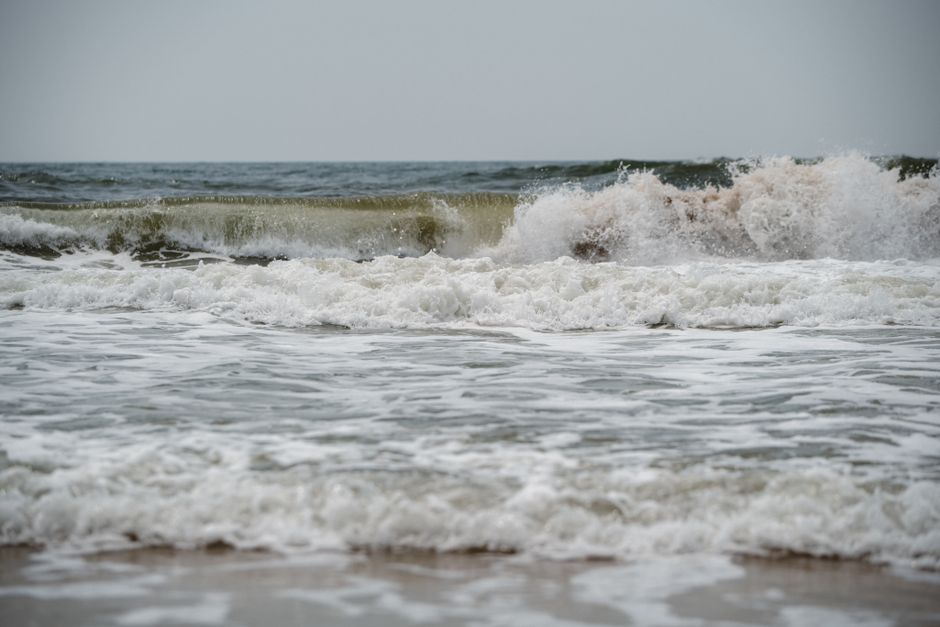 Captivating image of ocean waves crashing against the shore, showcasing nature's power and beauty.