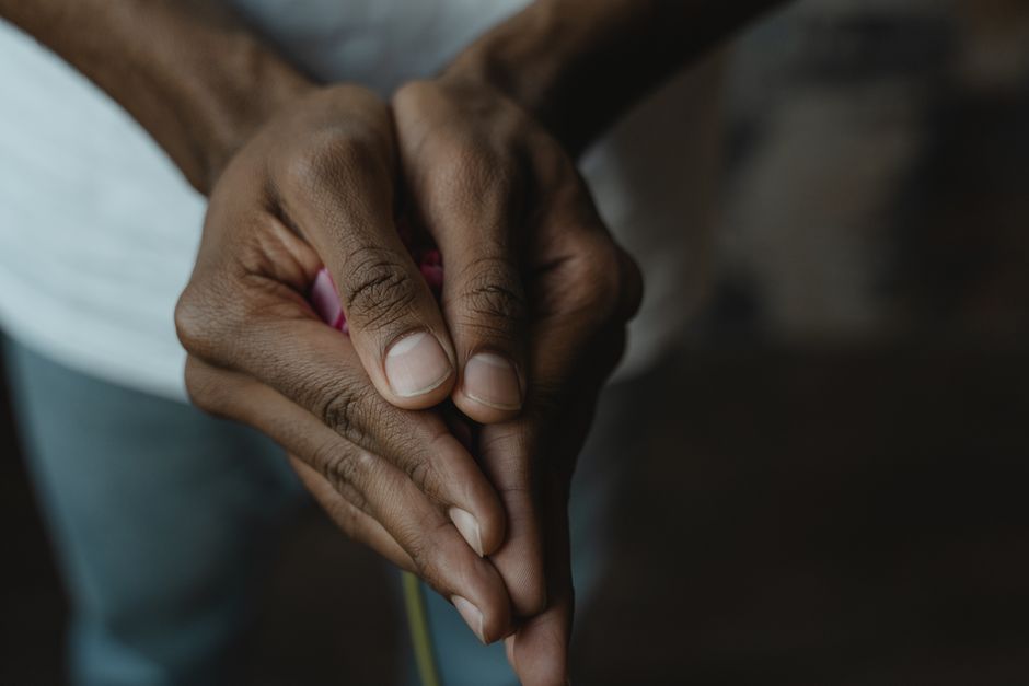 A detailed close-up of two hands clasped together, showcasing human connection.