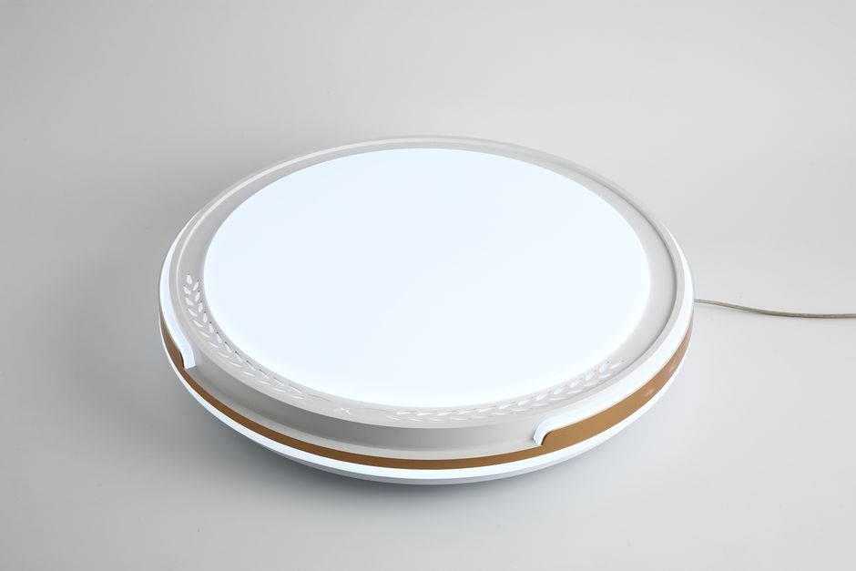 A sleek modern LED ceiling light with decorative edges on a neutral gray background, showcasing contemporary design.