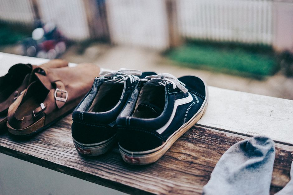 Shoes lined up on a rack by the front door